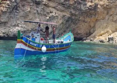 luzzu boat at santa maria caves malta