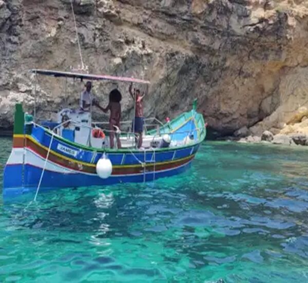 luzzu boat at santa maria caves malta