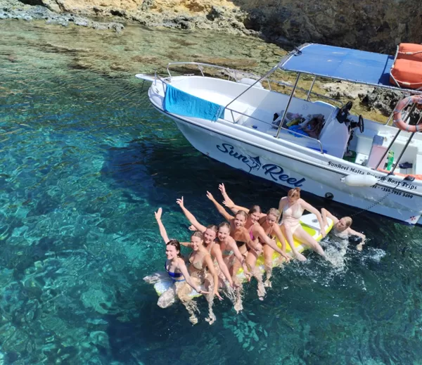 happy girls on a paddle boat in comino malta