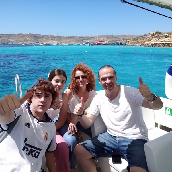 happy customers on a private boat comino malta gozo