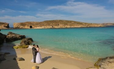 Groom and bride near Blue lagoon Malta on a honeymoon tour
