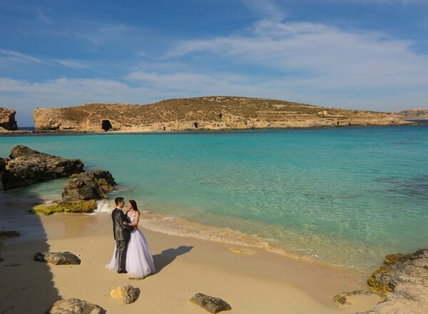 Groom and bride near Blue lagoon Malta on a honeymoon tour