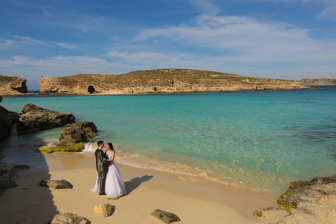 Groom and bride near Blue lagoon Malta on a honeymoon tour