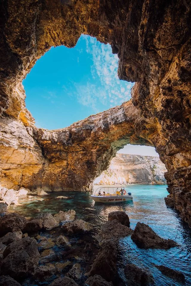 boat inside Popeye cave in crystal lagoon malta