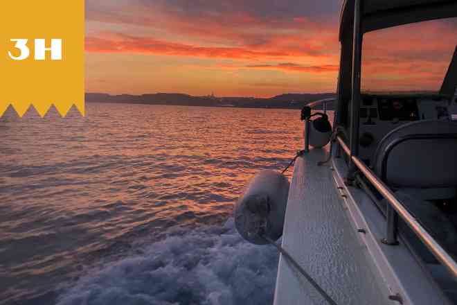 boat cruising on Sunset tour around comino