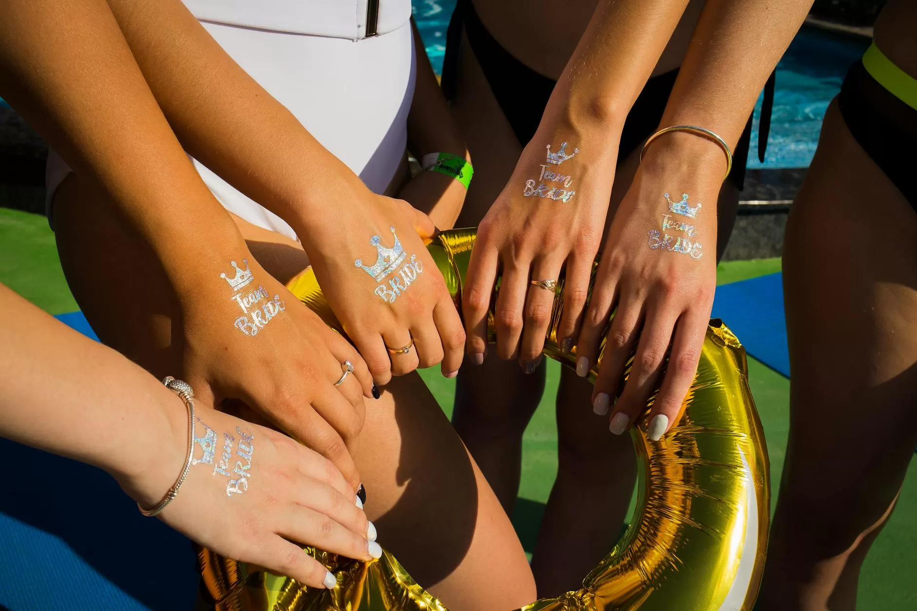 a bride and her bridesmaid with stickers on their hands