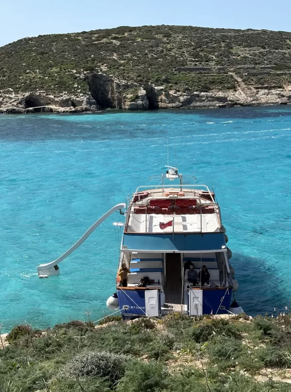 boat with a water slide on a shared boat trip at blue lagoon