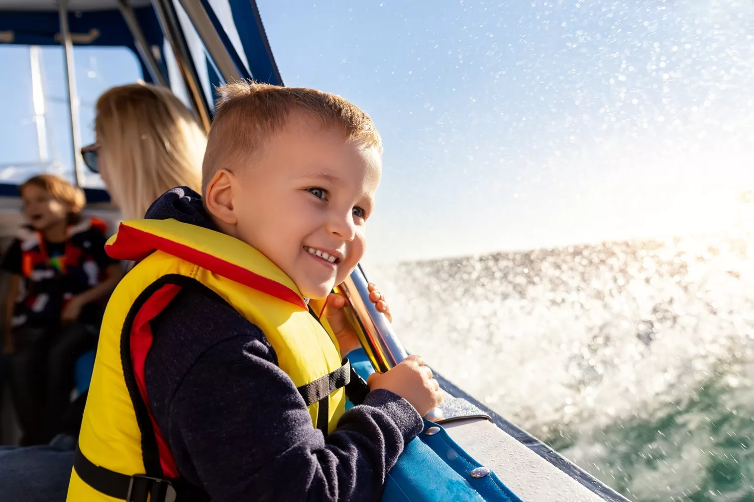 child with life vest on board blue lagoon tour