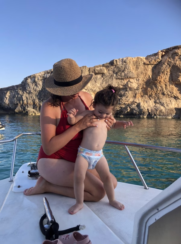 mother and daughter on a boat in comino malta