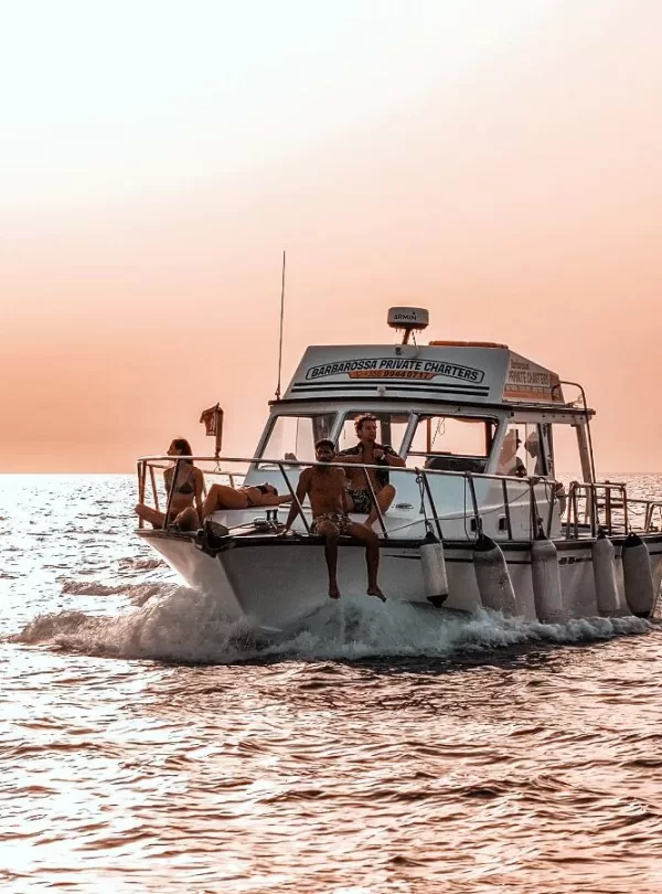 small group shared boat tour comino malta at sunset