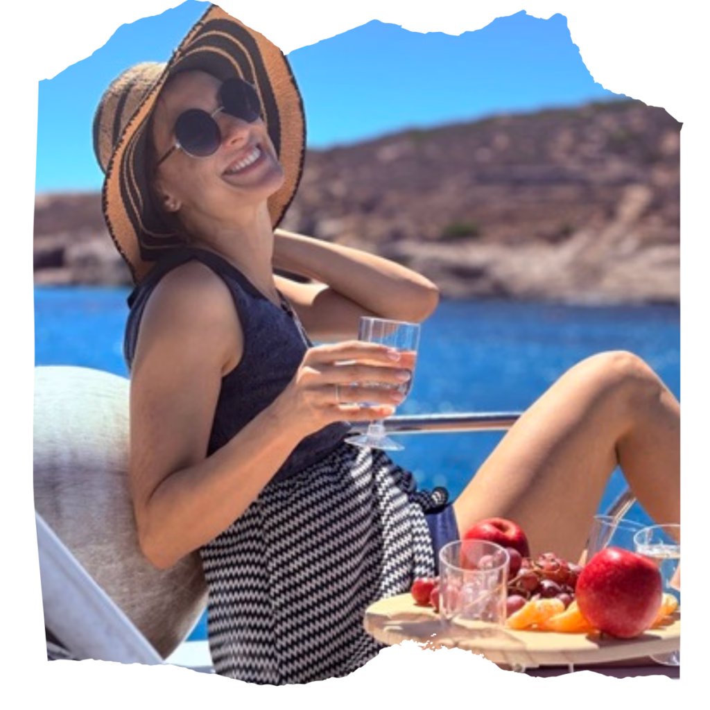 happy girl enjoying sun and fruits in blue lagoon malta